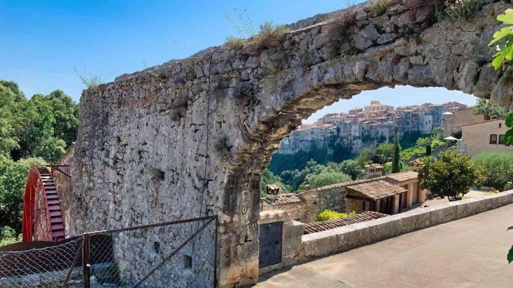 ancient aqueduct bringing water to the olive mill with the red iron wheel